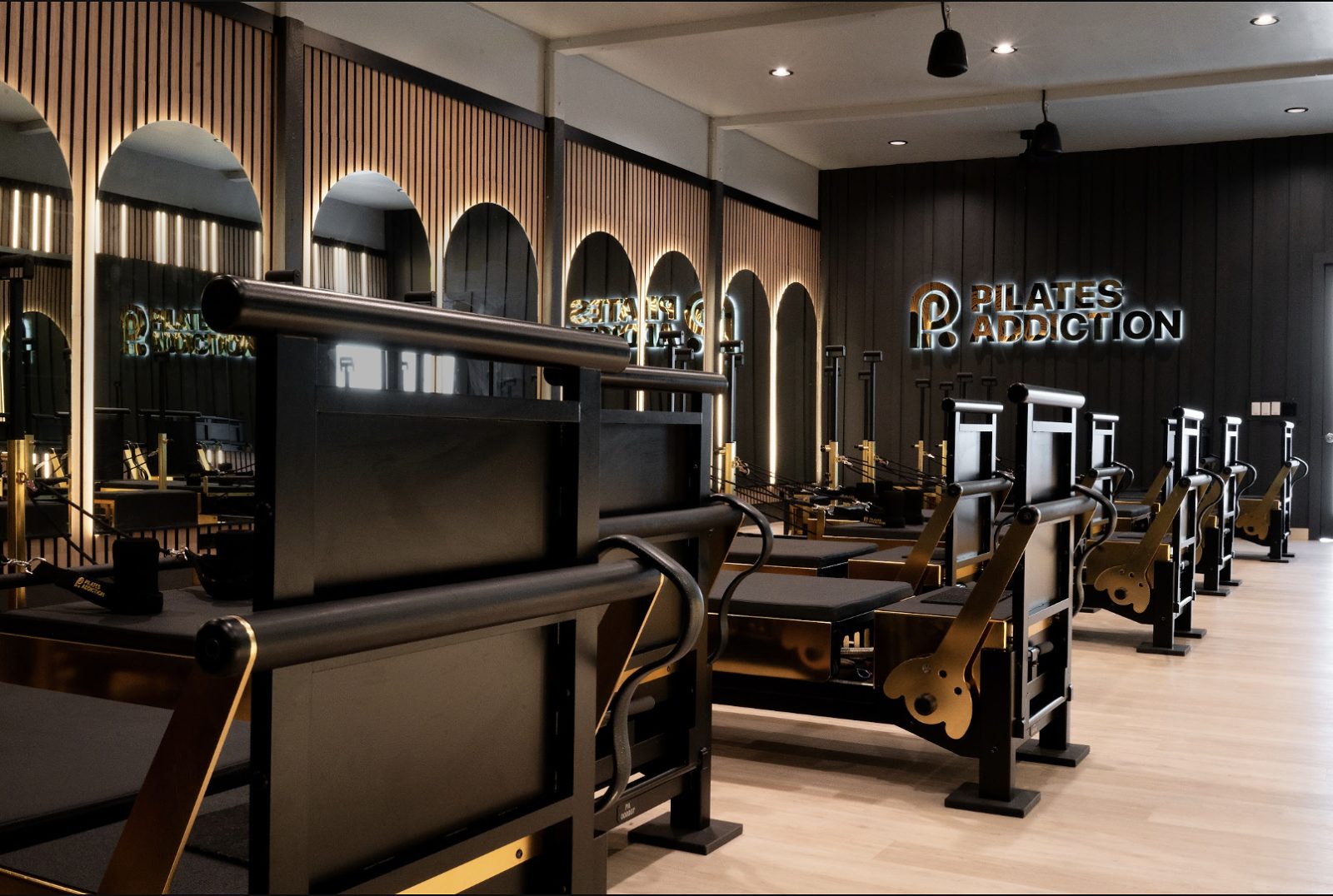 Pilates Addiction Reveals Local Owners, Gold-Plated Reformers Ahead of Vintage Park Opening